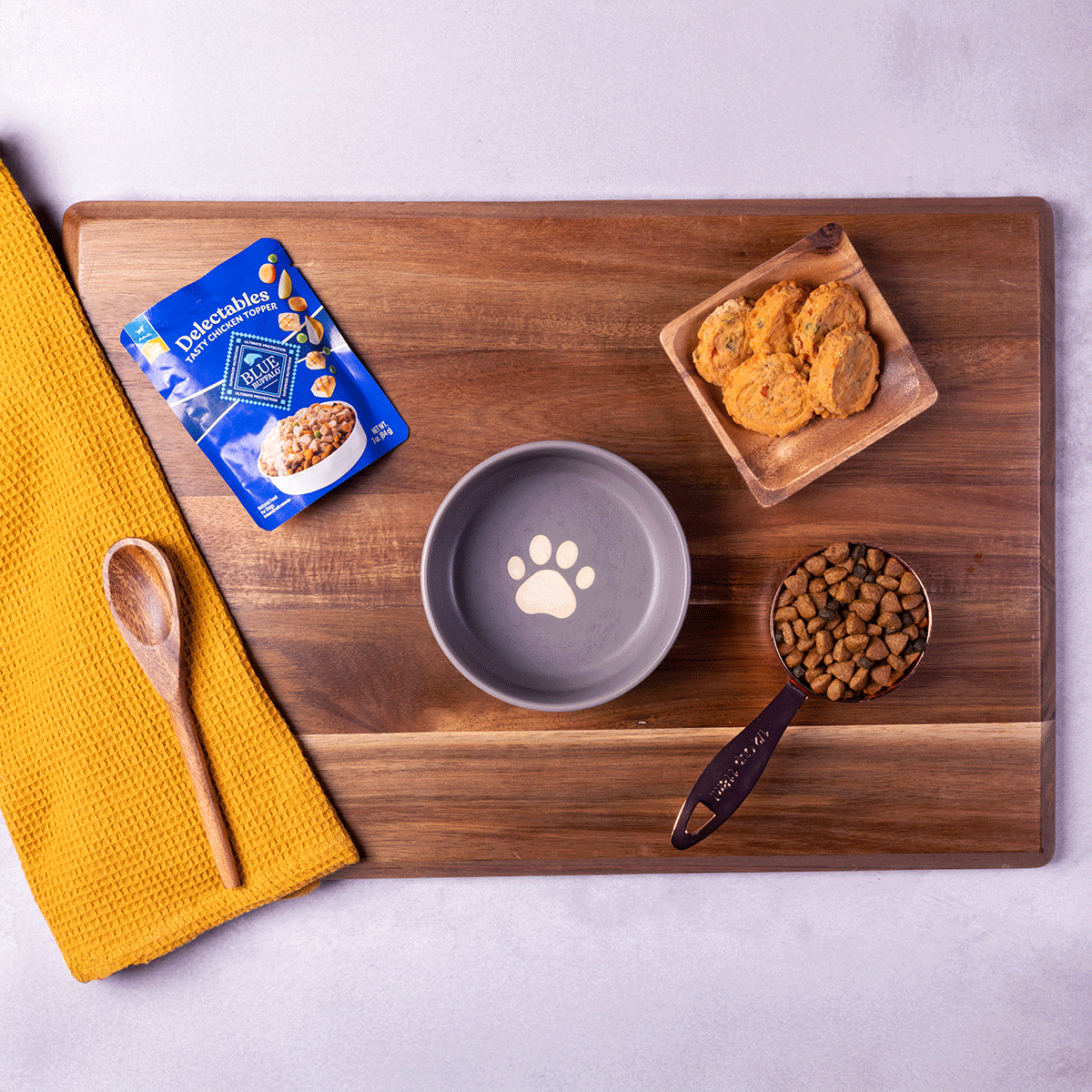 A GIF shows the ingredients being mixed to create a dog-friendly recipe.