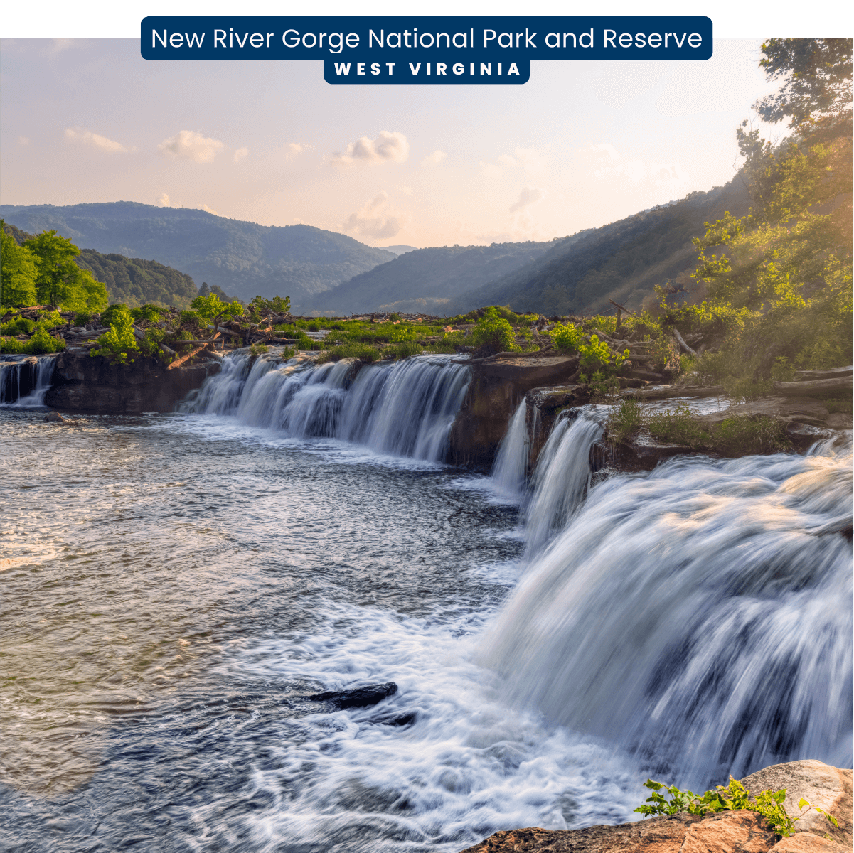Multiple waterfalls span across a grassy hilltop during sunset in New River Gorge National Park and Preserve, West Virginia.